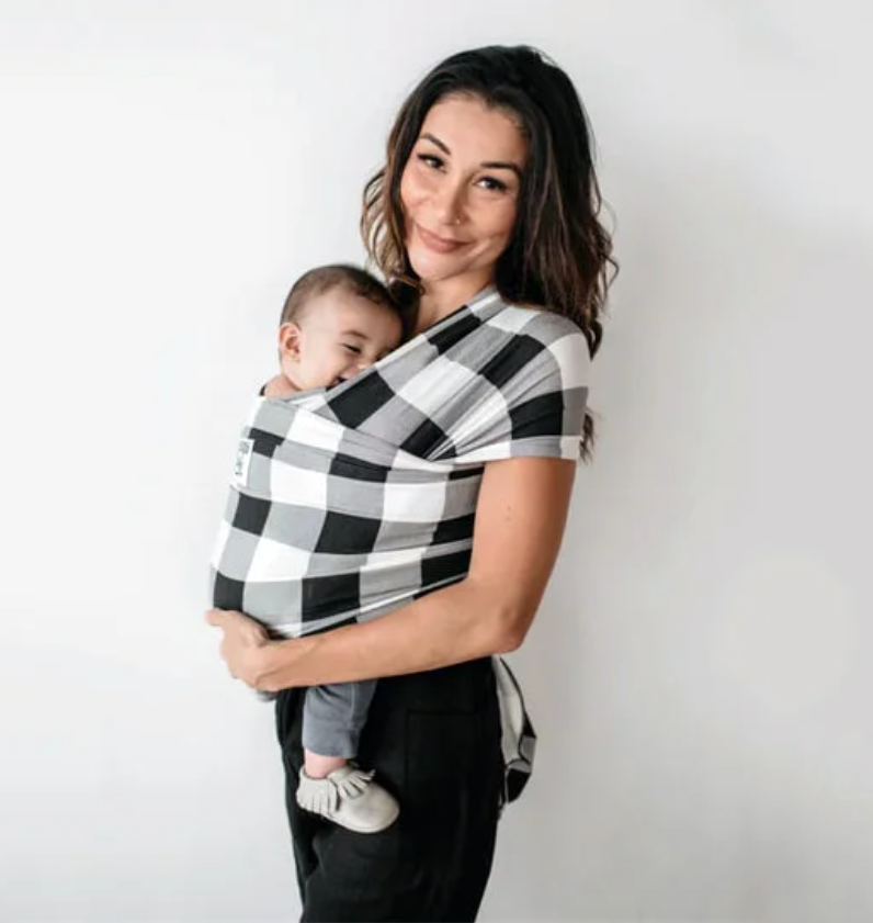 woman wearing baby in infant wrap